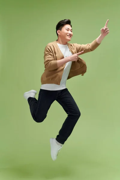 Full Length Excited Young Man Jump High Point Index Finger — Stock Photo, Image