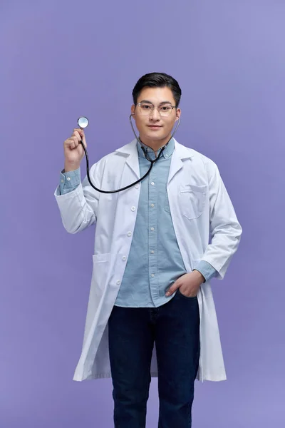 Handsome Young Medic Holding Stethoscope Isolated Purple — Stock Photo, Image