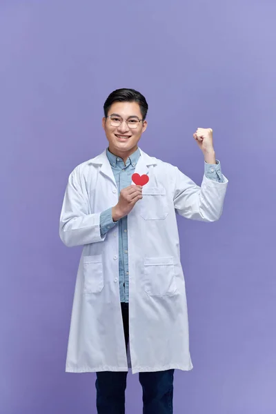 Doctor Man Holding Red Heart Clinic Screaming Proud Raised Arm — Stock Photo, Image