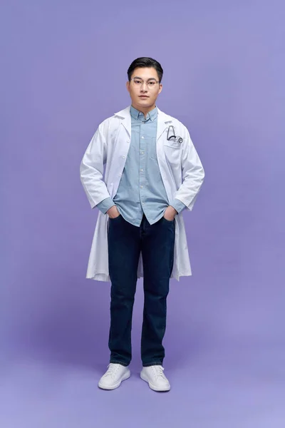 Handsome Young Doctor Dressing Gown Stethoscope Purple Background — Stock Photo, Image