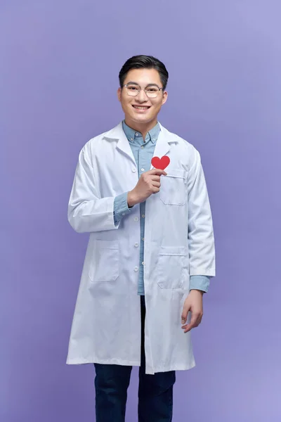 Handsome Young Doctor Man Holding Paper Red Heart — Stock Photo, Image