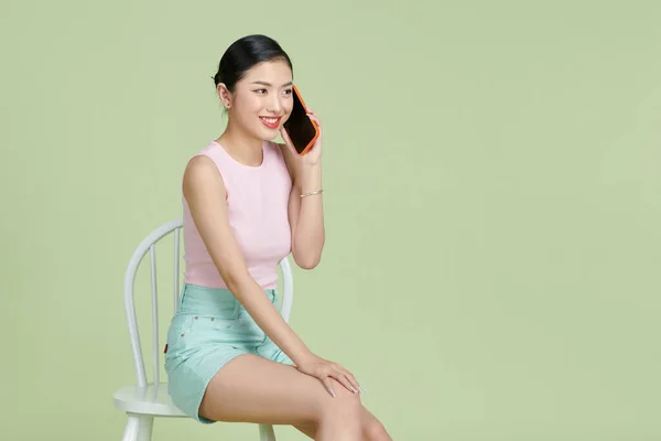 Pretty Smiling Girl Talking Smartphone Sitting Chair — Stock Photo, Image