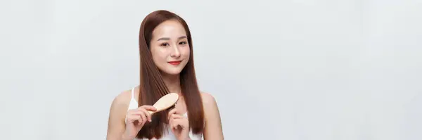 Banner Young Asian Woman Brushing Her Hair Smiling Isolated White — Stock Photo, Image