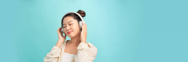 Happy asian girl throws party, dance in rhythm of music. Panorama