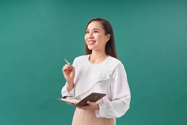 Young Businesswoman Standing Enjoy Using Pen Writing Diary Notebook Green — Stock Photo, Image