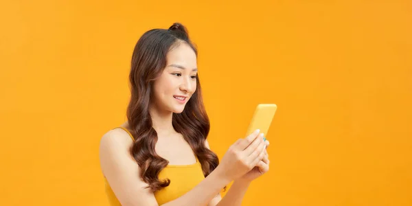 Smiling Young Woman Using Mobile Phone Vivid Yellow Background Panorama — Stock Photo, Image