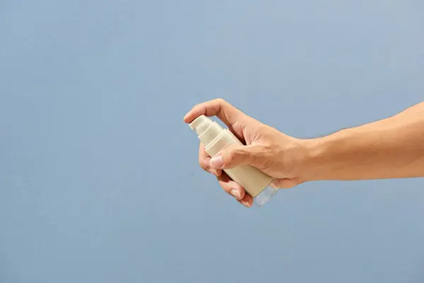 Hand Holding Spray Bottle Isolated Light Blue Background Clipping Path — Stock Photo, Image