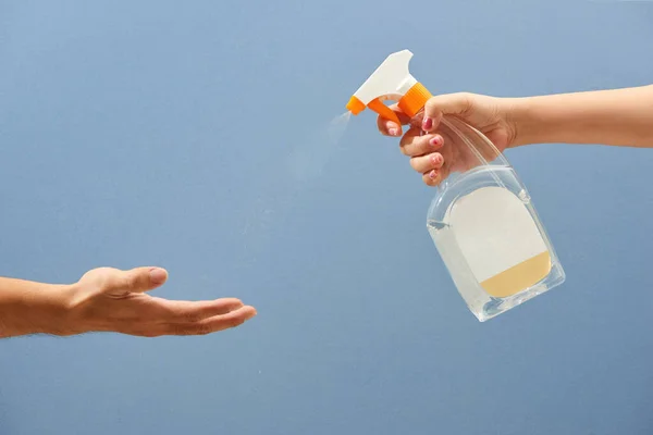 Spraying Antivirus Sanitizer Spray, Hand Sanitizer Dispenser, infection control concept.