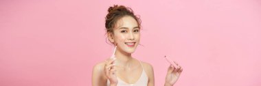 Beautiful elegance lady woman, has happy face, paints lips with red lipstick