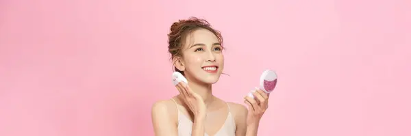 Portrait Beautiful Girl Smiling While Applying Face Powder Isolated Pink — Stockfoto