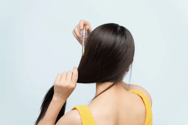 Woman Applying Moisturizing Oil Her Hair — Stock Photo, Image