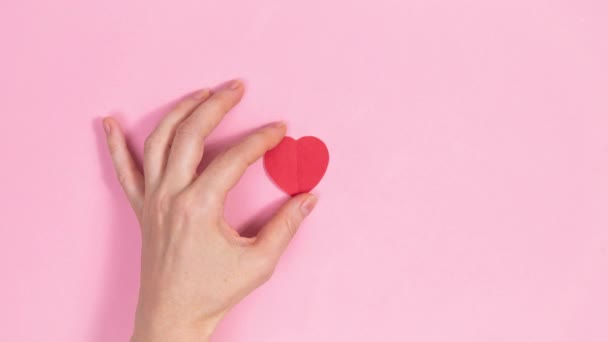 Small Red Heart Appears Fingers Woman Hand Which Transforms Origami — Stock videók
