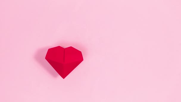 Red Origami Heart Appears Pink Background White Small Hearts Word — Vídeo de Stock