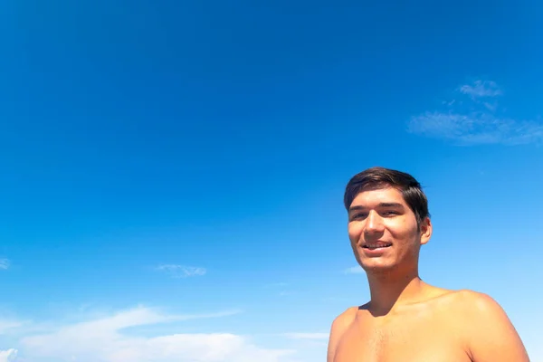 Portrait Young Tanned Smiling Guy Beach Blue Cloudless Sky Concept — Stock Photo, Image