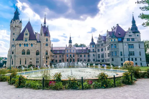 stock image Palace in Moszna. Historic residence located in the Opole Voivodeship. Upper Silesia, Poland. Beautiful view of the castle against the blue cloudy sky. Tourist and Historical Attraction.