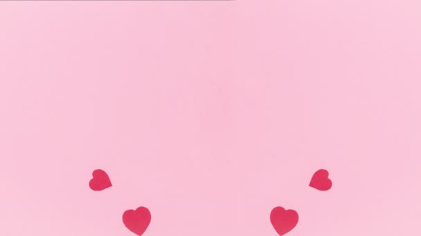 Ροζ Φόντο Ομάδα Από Κόκκινες Καρδιές Χαρτί Σύμβολα Της Αγάπης — Αρχείο Βίντεο