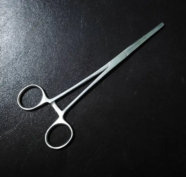 stock image Medical equipment Mosquito forceps Sterile Medical -  scissors to open stitches on the suture scar (scissor for aff heacting)