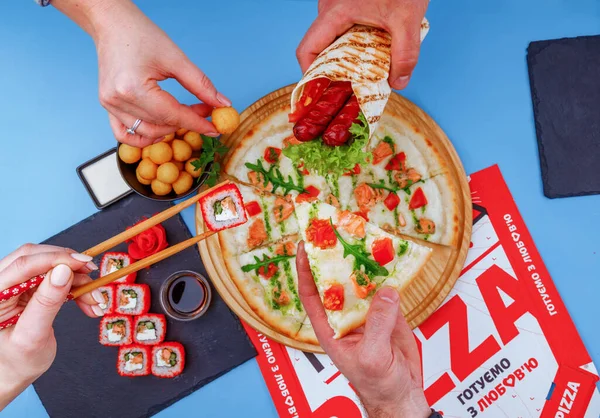 pizza shawarma sushi and potato balls on a blue background for an online restaurant menu