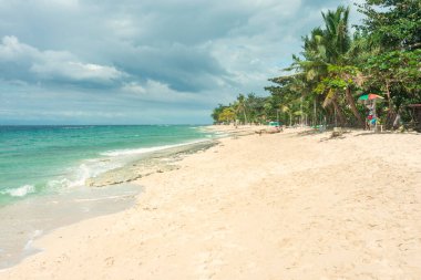 Beautiful fine,white sands of the tropical paradise beach and traveler's destination, on the south-western tip of Cebu. Popular resort for diving and snokrlelling with sea turtles and whale sharks.