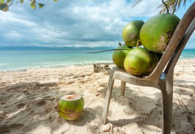 For drinking healthy coconut water. In the shade on a lazy tropical beach in the Philppines islands,with white,fine sand,clear blue sea,palm trees,clean,un-polluted,serene,idyllic and relaxing.