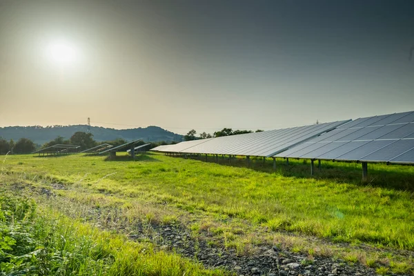 Solar energy production,at a site in the countryside, during the summertime in rural England,providing clean sustainable energy to local areas and villages,around the Gloucester area.