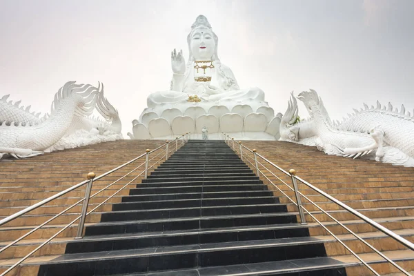 Beautiful black tiled staircase,and ornate structures,give access to the huge,hollow Buddhist structure.One can go inside,via lift,up to the head,a look through it\'s eyes,towering over the complex.