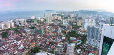 Stunning views of the downtown central city area and Malacca Strait,from the rooftop of George Town's tallest building and prominent landmark,close to sunset. clipart