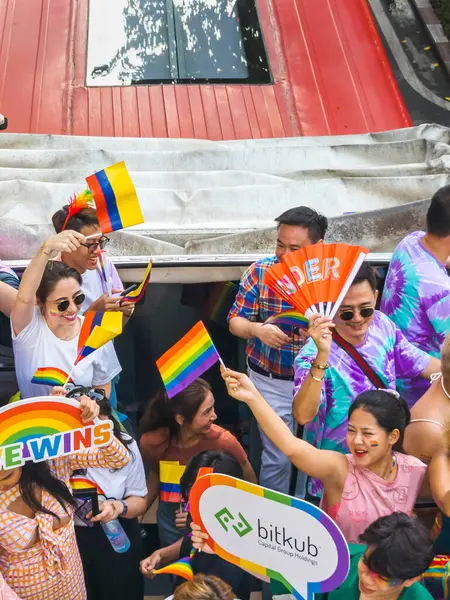 stock image Bangkok,Thailand - June 30 2024:Thousands of people from the LGBTQ community parade on buses,motorbikes,classic cars and by foot,celebrating love, gay marriage,equality,peace and sexual tolerance.