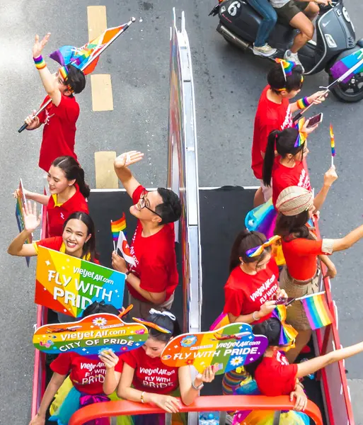 stock image Bangkok,Thailand - June 30 2024:Thousands of people from the LGBTQ community parade on buses,motorbikes,classic cars and by foot,celebrating love, gay marriage,equality,peace and sexual tolerance.