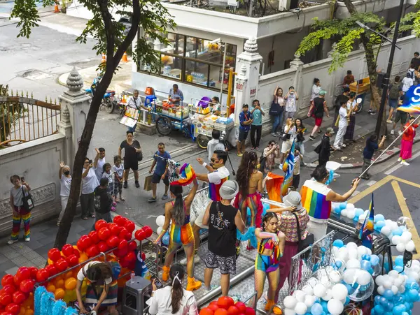 stock image Bangkok,Thailand - June 30 2024:Thousands of people from the LGBTQ community parade on buses,motorbikes,classic cars and by foot,celebrating love, gay marriage,equality,peace and sexual tolerance.