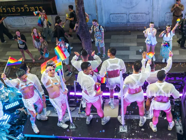 stock image Bangkok,Thailand - June 30 2024:Thousands of people from the LGBTQ community parade on buses,motorbikes,classic cars and by foot,celebrating love, gay marriage,equality,peace and sexual tolerance.