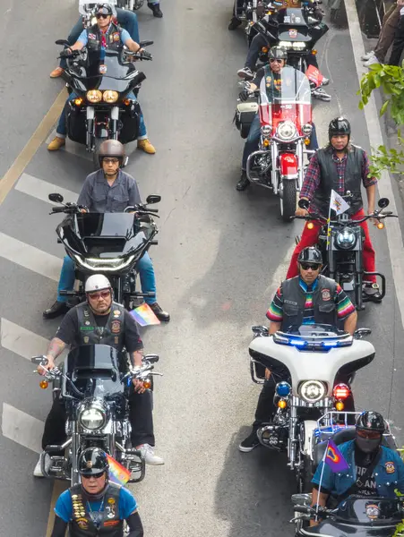 stock image Bangkok,Thailand - June 30 2024:Many gay male motorcyclists, from the BKK LGBTQIA community line up, before cruising past crowds of people lining the streets,celebrating tolerance and diversity.