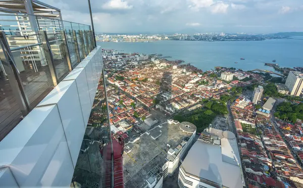 stock image Penang Island,Malaysia-April 26 2023: Stunning view of downtown area of the city,from the rooftop and Observatory Deck of George Town's tallest building and prominent landmark,as sunset approaches.