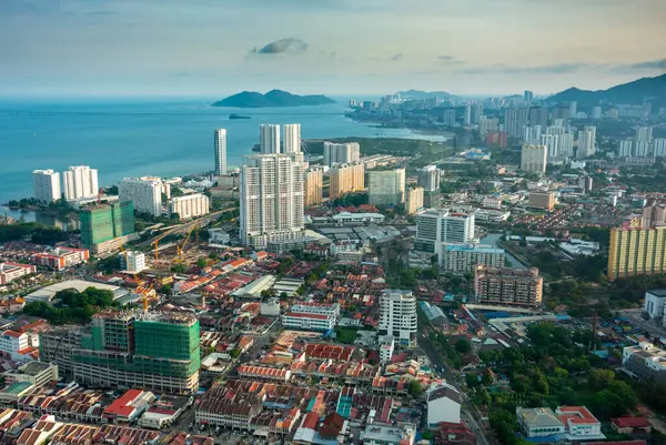 stock image Penang Island,Malaysia-April 26 2023: Stunning view of downtown area of the city,from the rooftop and Observatory Deck of George Town's tallest building and prominent landmark,as sunset approaches.