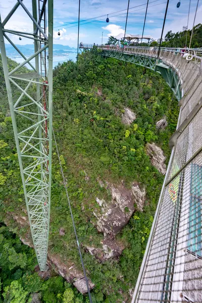 stock image Winding over the forested peaks of Mat Cincang,second highest mountain in Langkawi,a major tourist site with awesome views across the islands,amazing steel structure and peice of modern engineering.