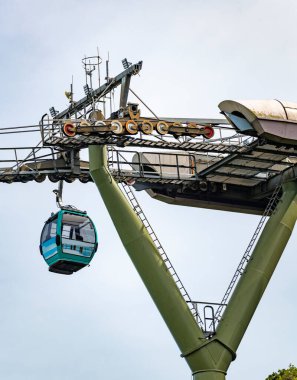 Cable cars run to and from the famous landmark,over tree covered mountain peaks,with beautiful views all around. of the coastline and mountain scenery of Langkawi. clipart