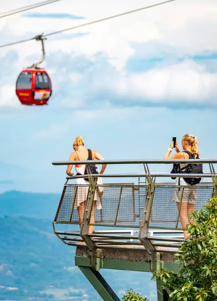 Stock image Langkawi Island,Malaysia-May 02 2023:Perched on the peaks of Mat Cincang,second highest mountain on the island,the Sky Cab,a gondola lift and major tourist attraction,runs above sightseeing tourists.