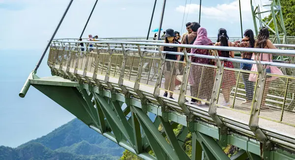 stock image Langkawi,Malaysia-May 03 2023:Winding high over the peaks of Mat Cincang mountain,the cable stayed bridge is a major tourist site with awesome views across the islands,1270 ft above sea level.