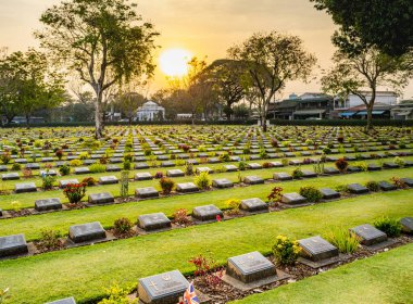 Sunset at the cemetery containing 6,982 graves of British, Australian and Dutch prisoners of war,victims of brutal conditions they suffered as forced labor,working to build the Thai-Burma railway during WWII.