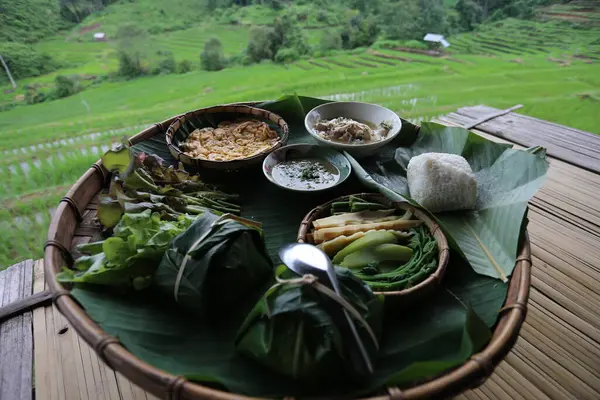 selective focus breakfast set, local food in the middle of rice fields in Thailand Eat simple meals at a hut in the middle of rice fields and forests. Breakfast at a countryside homestay, in Chiang Mai, Thailand