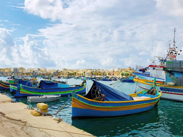 Fishing boats moored in the bay of Malta. Fishing village in the southeast of Malta. Marsaxlokk