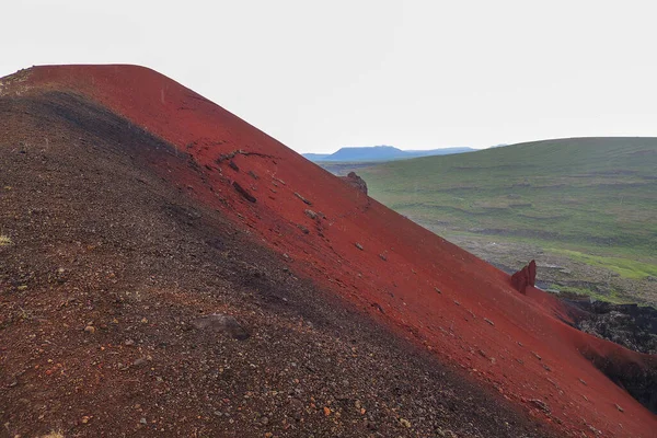 Iceland Red Volcano Erosion Landscape: A captivating stock photo showcasing the beauty of red volcanic erosion in Iceland.