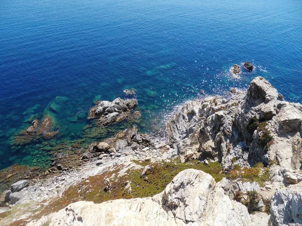 View of the Sea from the Rocks Top: A breathtaking image capturing a stunning view of the sea from the top of rocky cliffs.