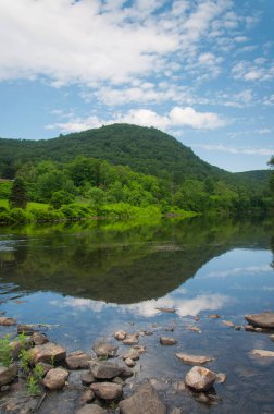 The hills of litchfield county above the housatonic river in West Cornwall Connecticut on a sunny summer day. 