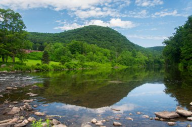 The hills of litchfield county above the housatonic river in West Cornwall Connecticut on a sunny summer day.