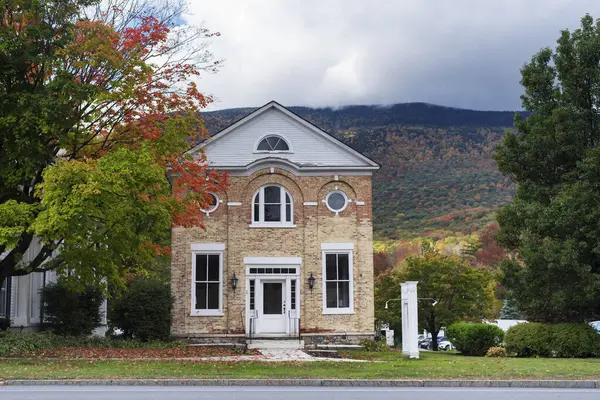 stock image the historic meeting hall in the town of Manchester Vermont in early autumn on a beautiful day in new england.