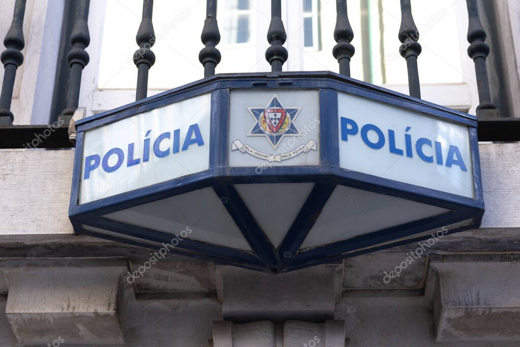 Lisbon, Portugal - December 11, 2024: Policia exterior sign on the police department building