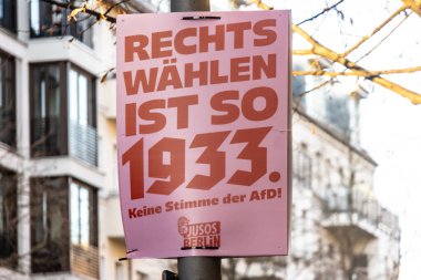 Berlin, Germany - January 13, 2025: Poster of the German Working Group of Young Socialists in the SPD political party Jusos, the slogan of the campaign is Voting right is so 1933. No vote for the AfD clipart