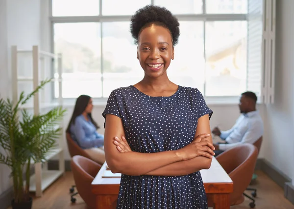 Portrait of smiling Black business woman standing with employees in office. High quality photo