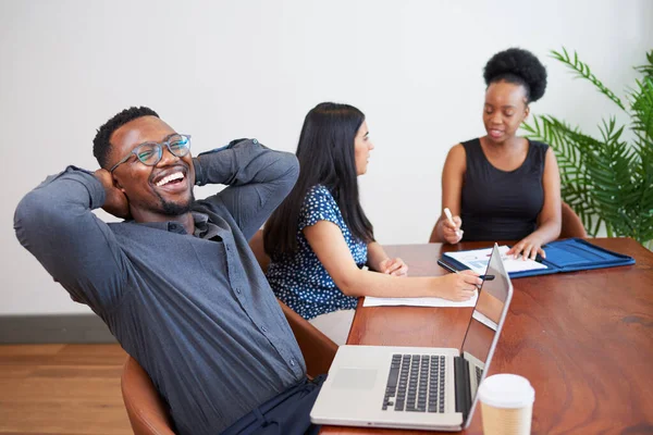 Black Businessman Laughs Relaxes Boardroom Table Arms Head High Quality — Stockfoto